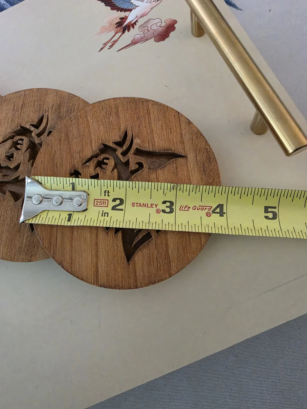 Custom carved wooden drink coaster featuring stylized Buffalo Bison silhouette